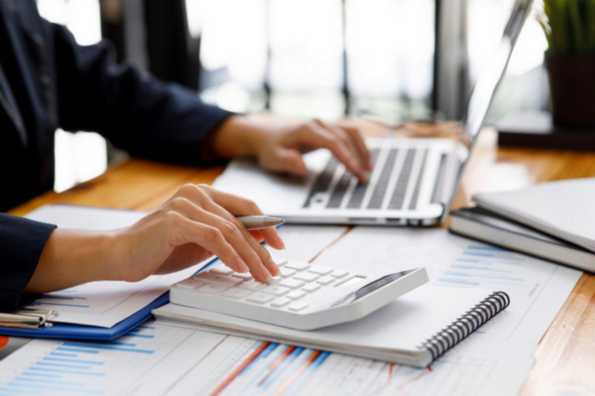 Businesswoman working at office with documents on his desk, doing planning analyzing the financial report, business plan investment, finance analysis concept